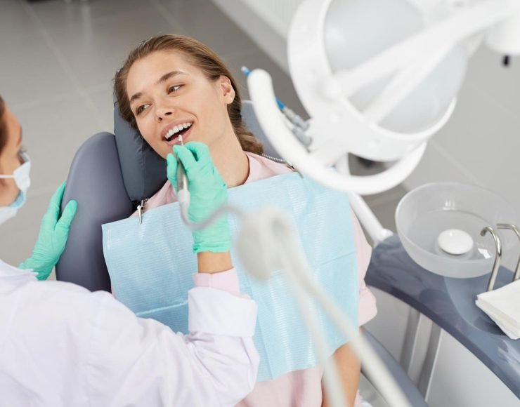 young-woman-at-dental-exam-3XD85GH.jpg